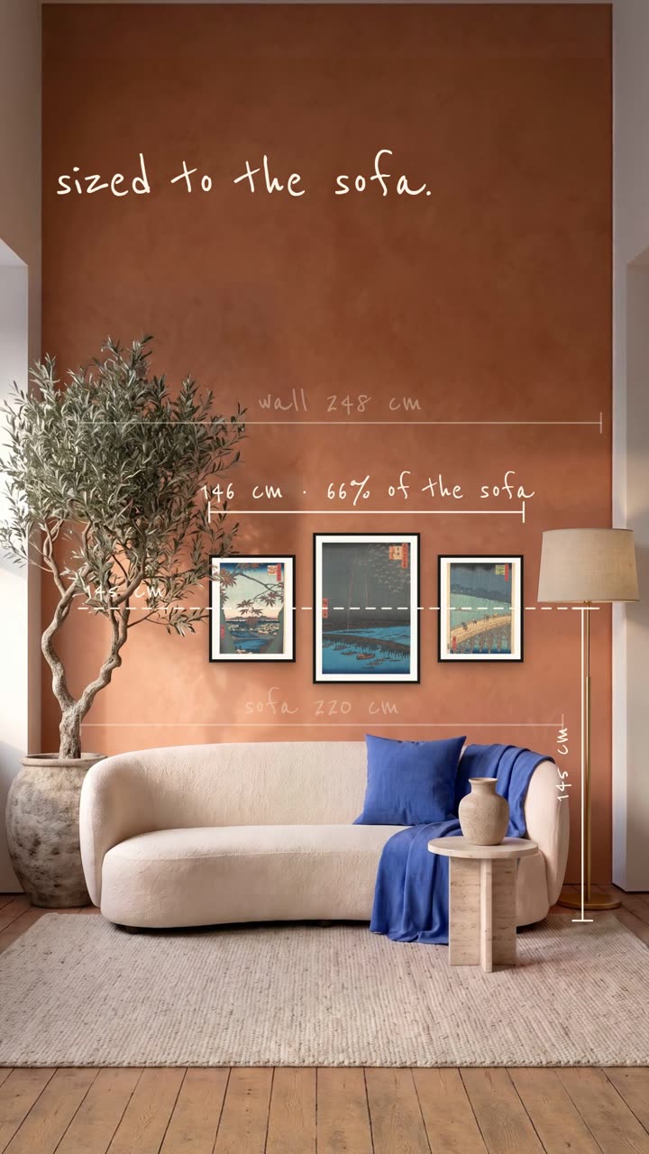Two thirds of the sofa – Three Hiroshige prints over a sofa, sized to two thirds of its width and hung at 145 cm.